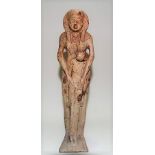 Egyptian style carved stone and painted figure of a wet nurse, the back with hieroglyphs, height