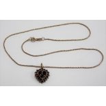 Gold garnet set heart shaped pendant upon 9ct hallmarked gold necklace, weight 4.4g approx