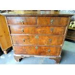 Early 18th Century mahogany veneered chest of two short over three long graduated drawers upon