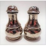 Pair of George V silver baluster pepperettes, maker MR, London 1932, weight 4.25oz approx.