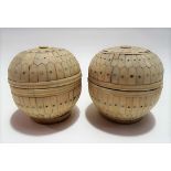 Pair of ivory covered ovoid boxes with brass liners, height 9.5cm.