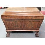 George III flame mahogany veneered shaped wine cooler of sarcophagus form with hinge lid, raised