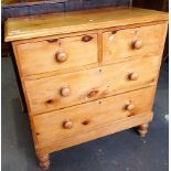 Early 20th Century stripped pine chest of two short over two long drawers upon turned feet, width