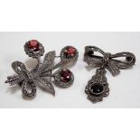 Silver hallmarked garnet set marcasite foliate brooch together with another 9ct marcasite brooch