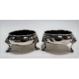 Pair of George III silver circular section salts, raised on triple outswept pad feet, maker TD?,