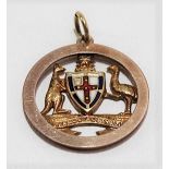 9ct hallmarked gold fob of Australian interest, the pierced circular fob with enamel shield