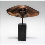 Small contemporary bronze sculpture cast as a mask, the back signed Michel, upon a rectangular slate