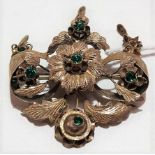 Early 20th Century gold green stone set brooch of openwork foliate design and with three foliate
