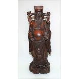 Chinese carved wood figure of a gentleman holding a sceptre wearing a hat and robes, height 40cm.