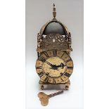 A 17th Century brass lantern clock case with replacement two-train movement, the 6.5in chaptering