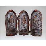 Chinese bronze triptych folding shrine, the exterior cast with leaf scrolls and character marks,