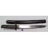 A Japanese short sword with fabric woven fish skin grip and steel tsuba, with black lacquer