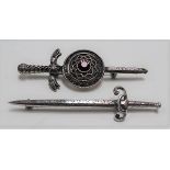 Modern Scottish silver sword kilt pin by Miracle; together with a base metal paste set kilt pin (