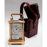 Miniature brass carriage timepiece, the 1.25in white enamel dial with Roman Numerals, within a