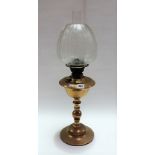 Brass oil lamp with etched clear glass shade, height 59cm.