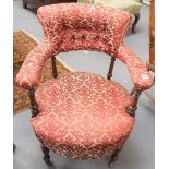 Victorian walnut button-back upholstered tub chair with turned legs and castors