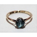 9ct gold ring set a blue circular cut stone, weight 1.7g approx