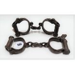 Two pairs of 19th Century steel handcuffs