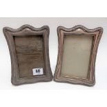Pair of George V silver rectangular photograph frames, the shaped frames with beaded borders and