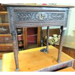 18th Century oak side table with single drawer and on turned legs with pad feet, later carved