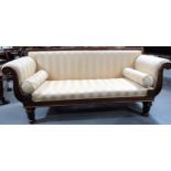 William IV mahogany upholstered settee with scroll leaf carved arms and raised on four turned and