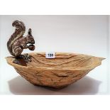Novelty 800 silver applied nut bowl, the wood bowl carved as a nutshell and applied with a silver