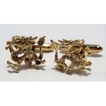Pair of modern 14ct gold cuff links modelled as coiling dragons, stamped 14k, weight 10.7g approx