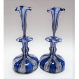 Pair of Venetian glass blue and opaque white twist decanters and stoppers, the flared stoppers of