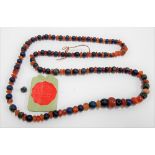 Possibly Ancient Egyptian blue and orange stone bead necklace with old label 'Guaranteed Genuine