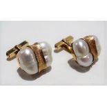 14ct gold baroque pearl set pair of cufflinks, stamped 14K, each cufflink set with two irregular