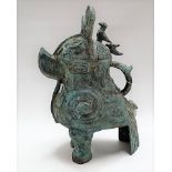 Chinese Zhou Dynasty style bronze vessel modelled as a mythical creature with loop handle, lid