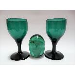 Pair of 19th Century green glass wine glasses with tapering stems upon a circular foot, height 13cm;