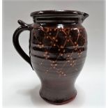 Studio Pottery slipware jug with trellis decoration, stamped personal and pottery seals, height 22.