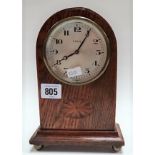 Oak inlaid cased eight day mantel clock with 3.25in silvered dial with Arabic Numerals raised on