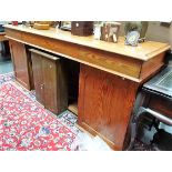 Victorian pitch pine twin pedestal sideboard, the moulded top over three frieze drawers over twin