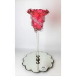 Early 20th Century cranberry and clear glass epergne upon a lobed mirror base, height 40cm.