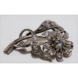 White metal diamond set flower brooch, the large central stone a CZ replacement, the petals and