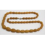 Butterscotch amber oval graduated bead necklace, length 72cm, the largest bead 10mm, weight 48g