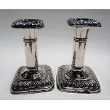 Pair of Edwardian silver candlesticks by Ellis Jacob Greenberg, with gadrooned square section sconce