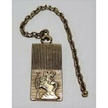 15ct gold engine turned rectangular St. Christopher pendant with applied yellow metal short chain,