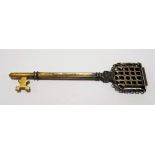 Ornate lacquered brass key with portcullis finial inscribed Sutton Valence School to one side, the