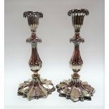 Pair of Victorian silver plate candlesticks of fluted baluster form and with star shaped foot,