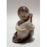 Royal Copenhagen model of a boy cuddling a chicken, no. 2445, height 6cm