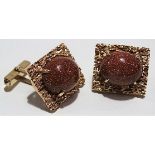 Pair of modern 14ct gold Aventurine set cufflinks, the oval cabochons in a rectangular textured