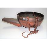 Large copper hanging cauldron with spout and suspension chains, length overall 73cm.