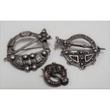 Three silver Scottish clan annular pins.