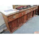 Pitch pine dresser base, the replacement top over six projecting drawers over six cupboard doors,
