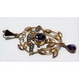 9ct gold amethyst and seed pearl set Art Nouveau openwork pedant, of foliate scroll design with a