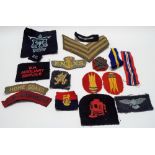 A collection of military cloth badges