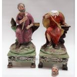 Pair of 19th Century Staffordshire pearlware figures of St Peter and St Paul, each modelled seated